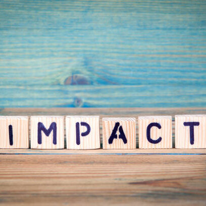 impact - name from wooden letters. Office desk, informative and communication background